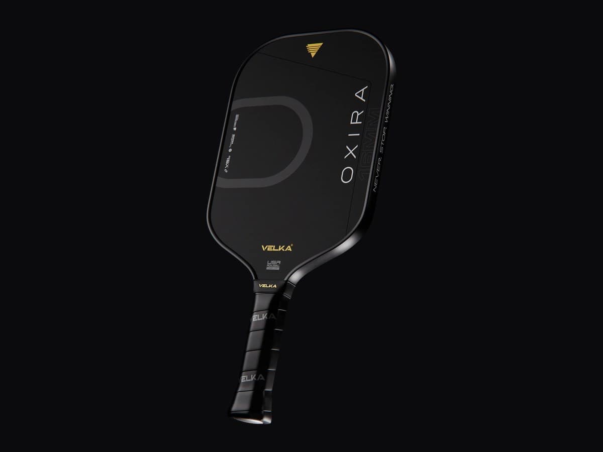 The face of a Velka Oxira pickleball paddle, black with a gold mark at the throat